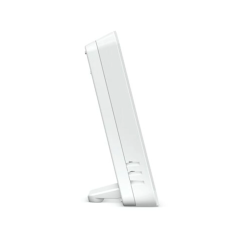 Vue latérale du boîtier thermostat blanc avec fentes d'aération pour capteur d'humidité relative.